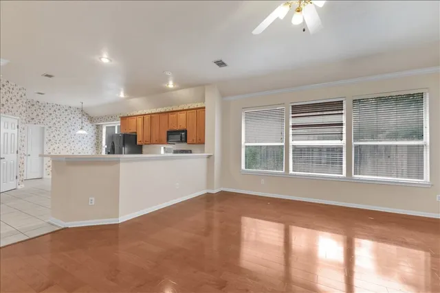 a view of an empty room with a window