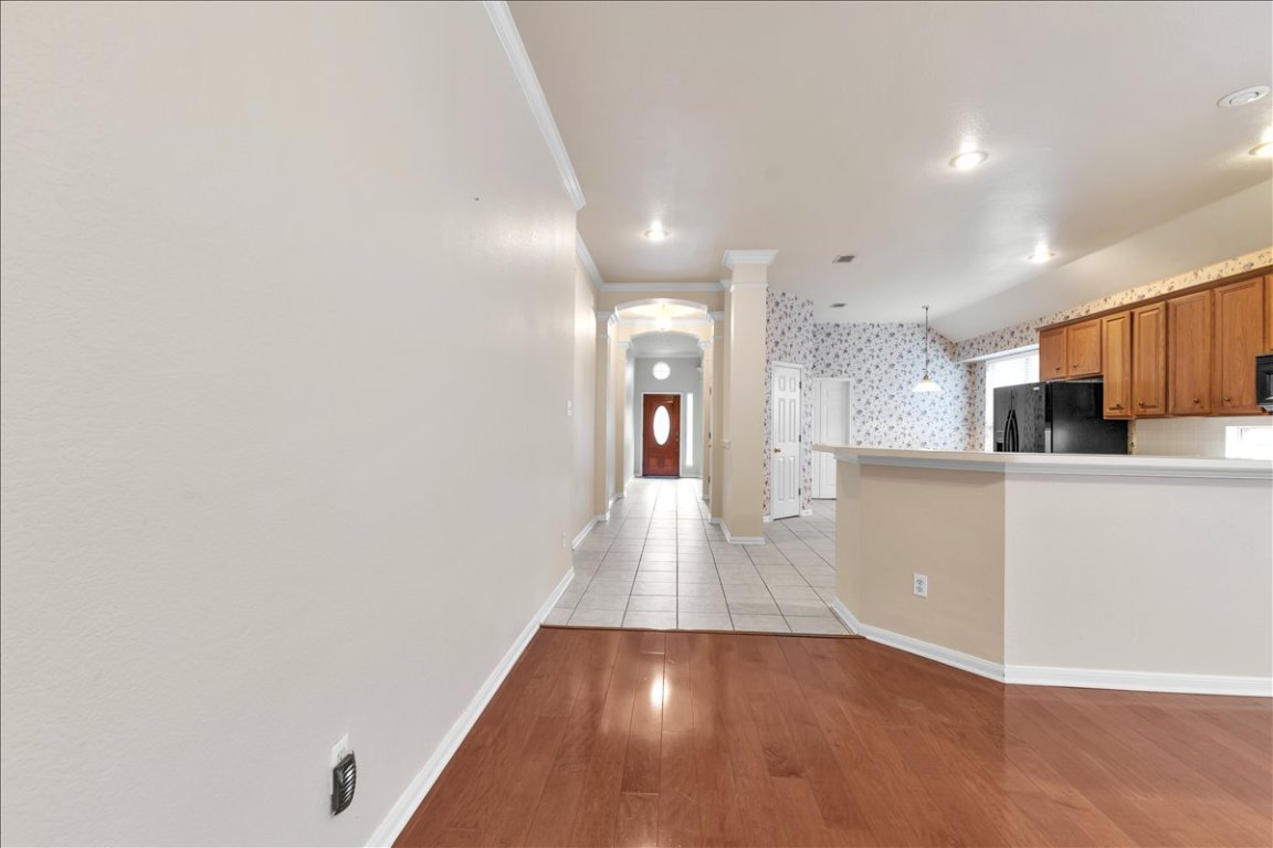 9237 La Siesta Bend Austin, TX 78749 - Photo 17 of 29 a view of a kitchen with wooden floor and a sink