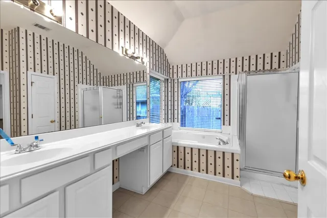 a bathroom with a bathtub and a sink