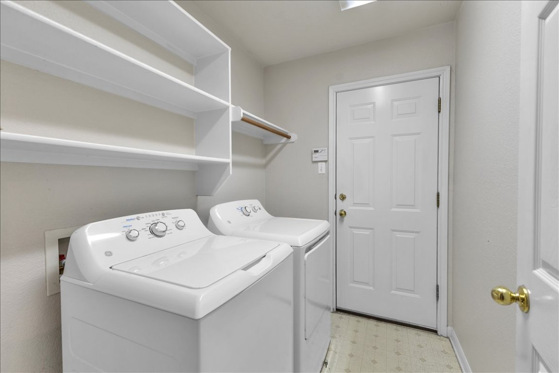 9237 La Siesta Bend Austin, TX 78749 - Photo 24 of 29 a utility room with dryer and washer