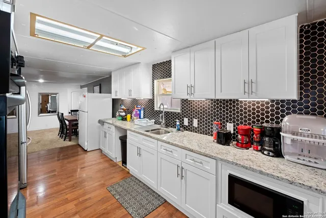 a kitchen with granite countertop lots of counter top space