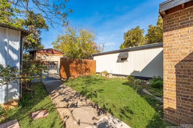 a backyard of a house with lots of green space