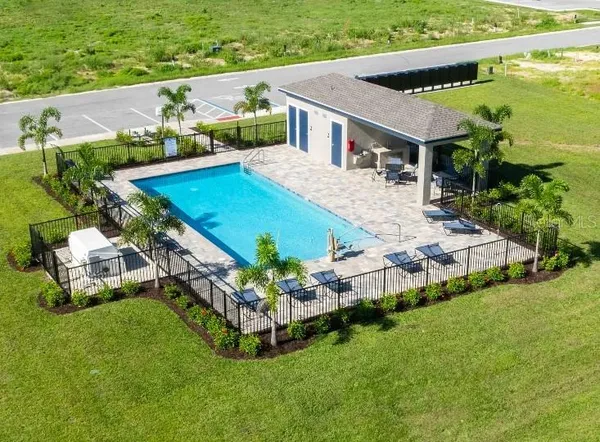 a view of a pool with a yard