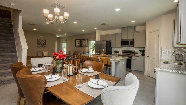 3592 Summitview Drive Lakeland, FL 33803 - Photo 7 of 23 a kitchen with a dining table and chairs