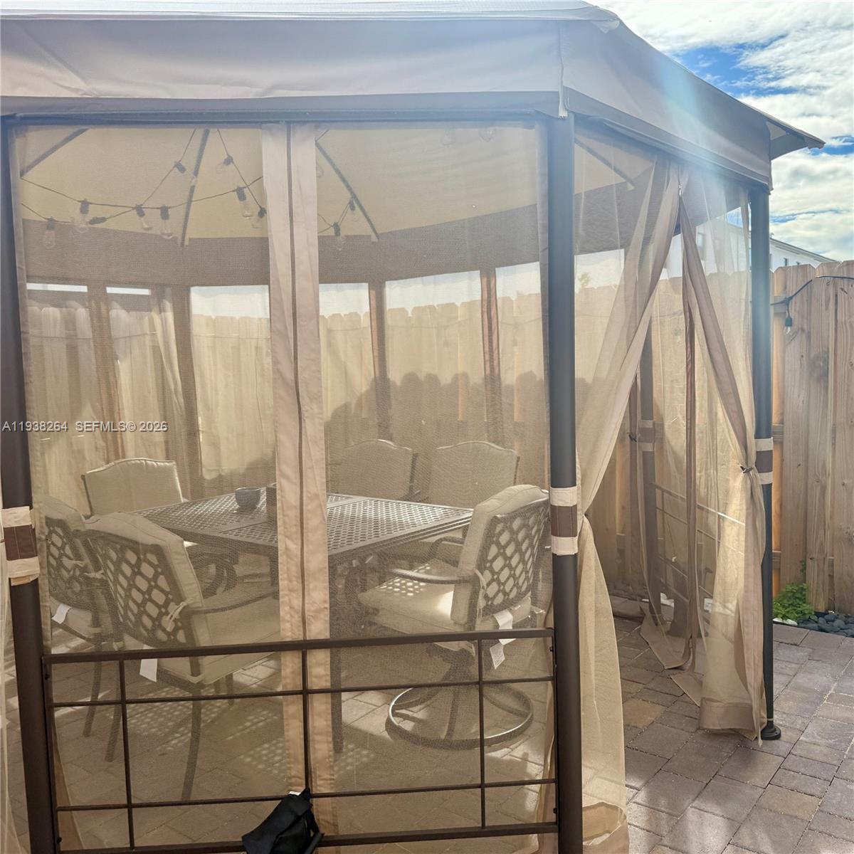 23049 Southwest 129th Place Miami, FL 33177 - Photo 13 of 33 a view of a balcony with wooden floor and furniture