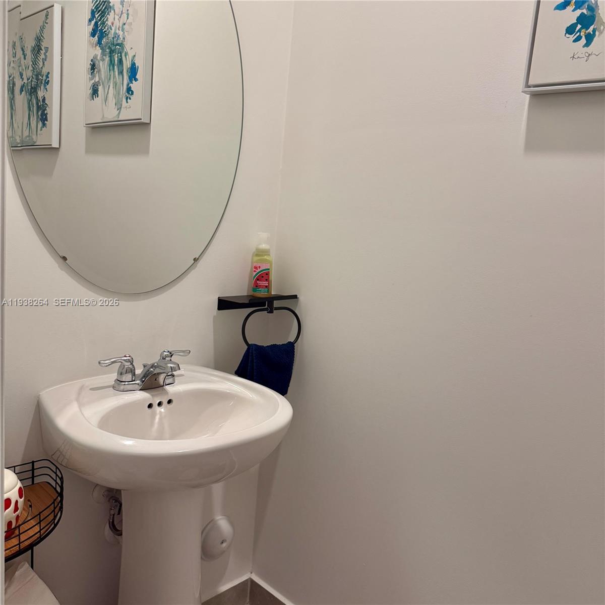 23049 Southwest 129th Place Miami, FL 33177 - Photo 17 of 33 a bathroom with a sink and a mirror