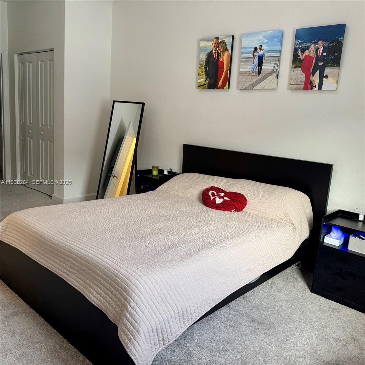 23049 Southwest 129th Place Miami, FL 33177 - Photo 24 of 33 a bedroom with a bed and a dresser