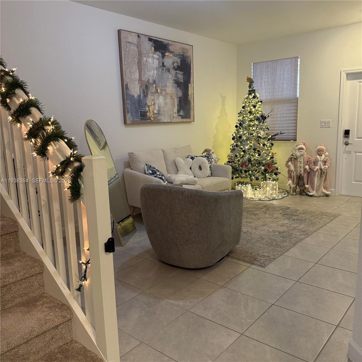 23049 Southwest 129th Place Miami, FL 33177 - Photo 3 of 33 a living room with furniture and a chandelier