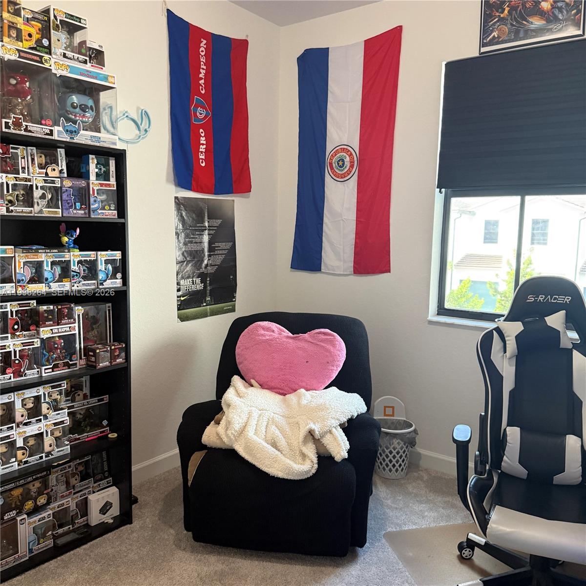 23049 Southwest 129th Place Miami, FL 33177 - Photo 32 of 33 a living room with furniture and book shelf