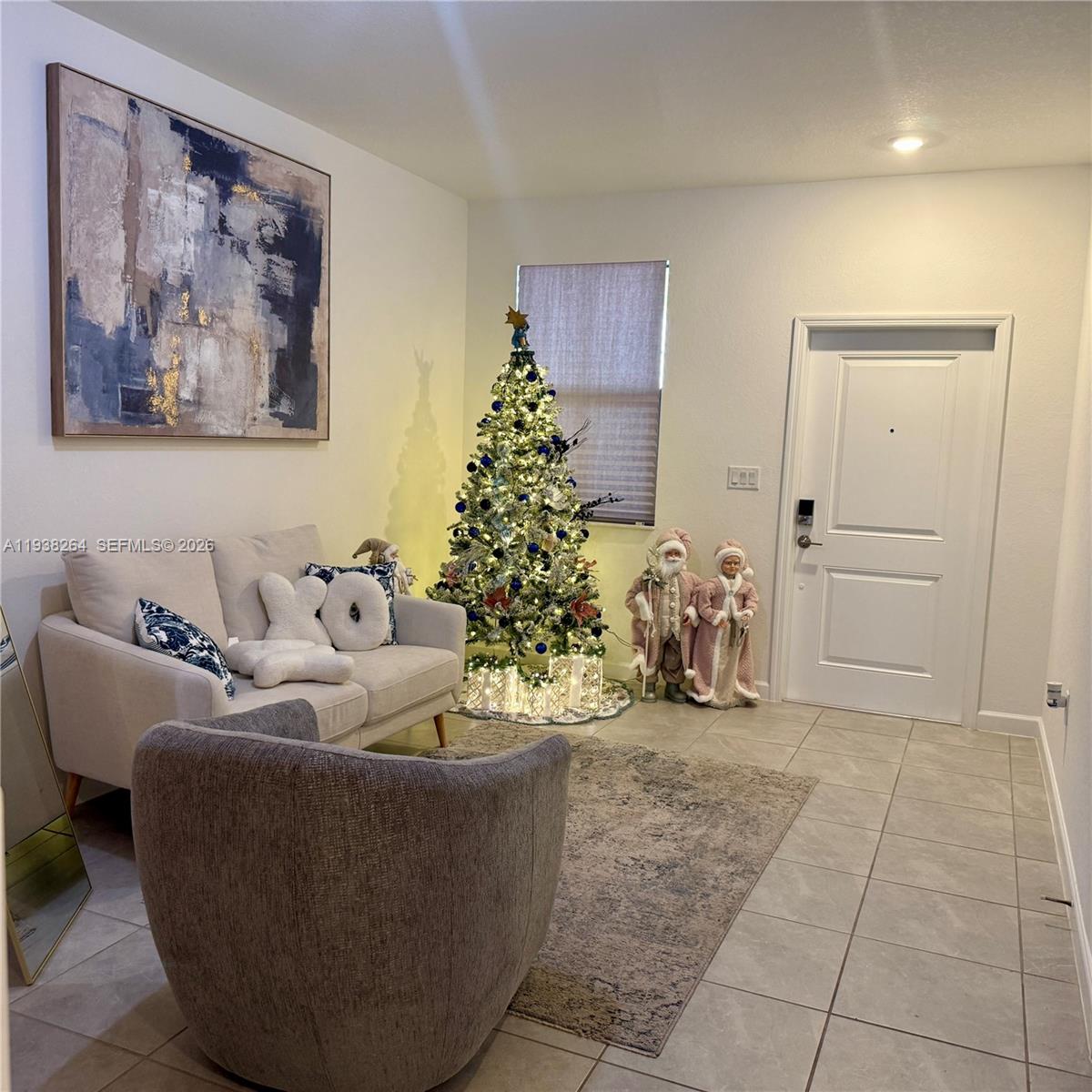 23049 Southwest 129th Place Miami, FL 33177 - Photo 4 of 33 a living room with furniture and a chandelier