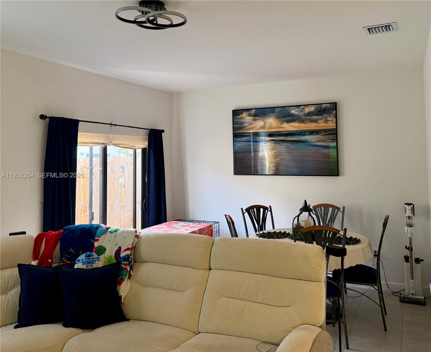 23049 Southwest 129th Place Miami, FL 33177 - Photo 7 of 33 a living room with furniture and a window