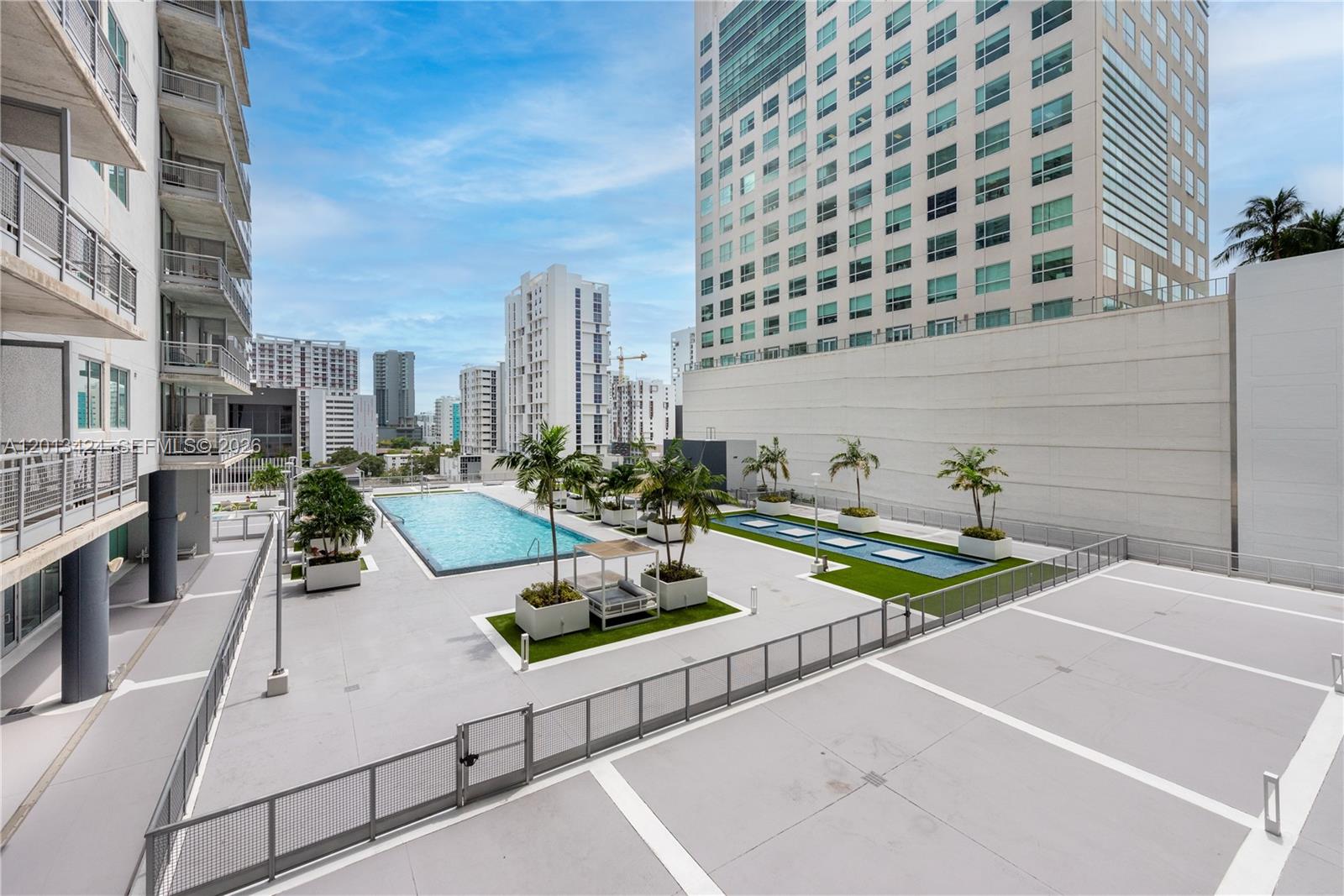 690 Southwest 1st Court, Unit 1034 Miami, FL 33130 - Photo 3 of 12 a view of a patio with swimming pool
