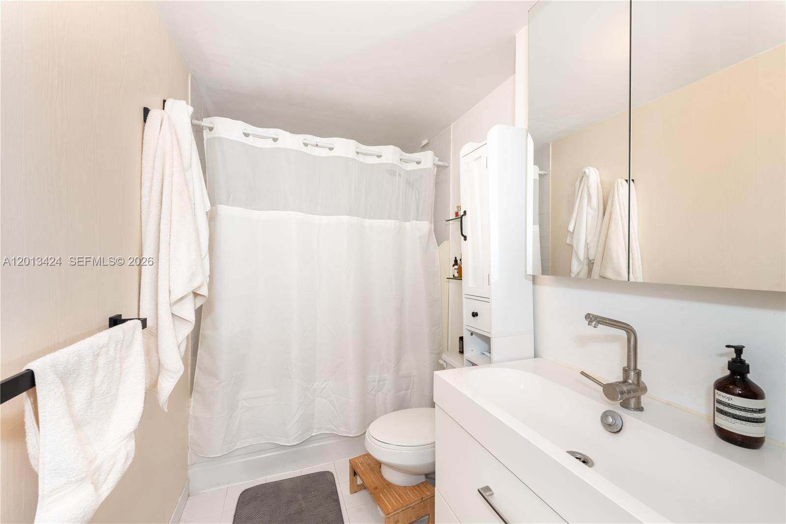 690 Southwest 1st Court, Unit 1034 Miami, FL 33130 - Photo 10 of 12 a bathroom with a sink toilet and shower