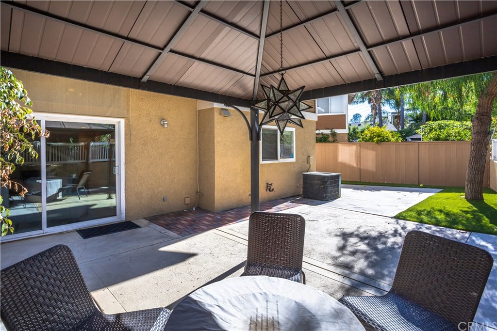 11 Silveroak Aliso Viejo, CA 92656 - Photo 14 of 41 a patio of a house with yard fountain and outdoor seating