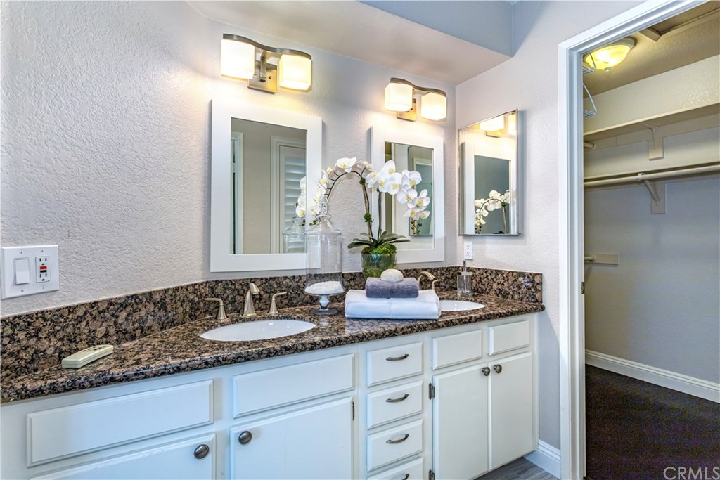 11 Silveroak Aliso Viejo, CA 92656 - Photo 20 of 41 a bathroom with a granite countertop sink and a mirror