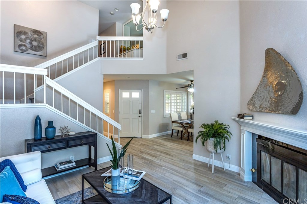 11 Silveroak Aliso Viejo, CA 92656 - Photo 2 of 41 a living room with furniture and a fireplace