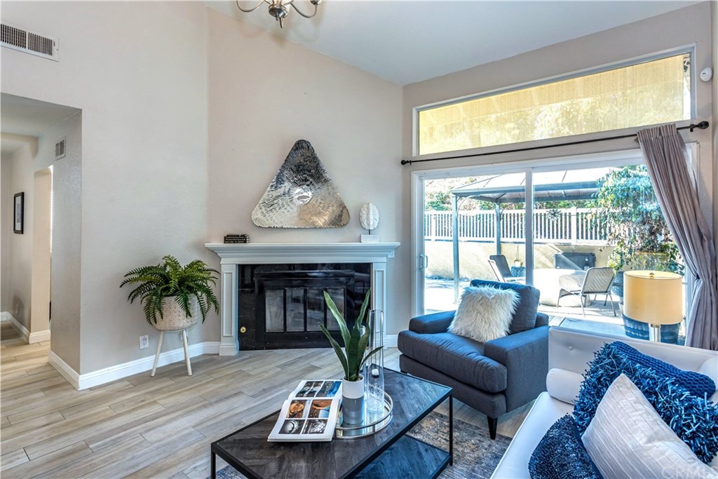 11 Silveroak Aliso Viejo, CA 92656 - Photo 3 of 41 a living room with furniture and a fireplace