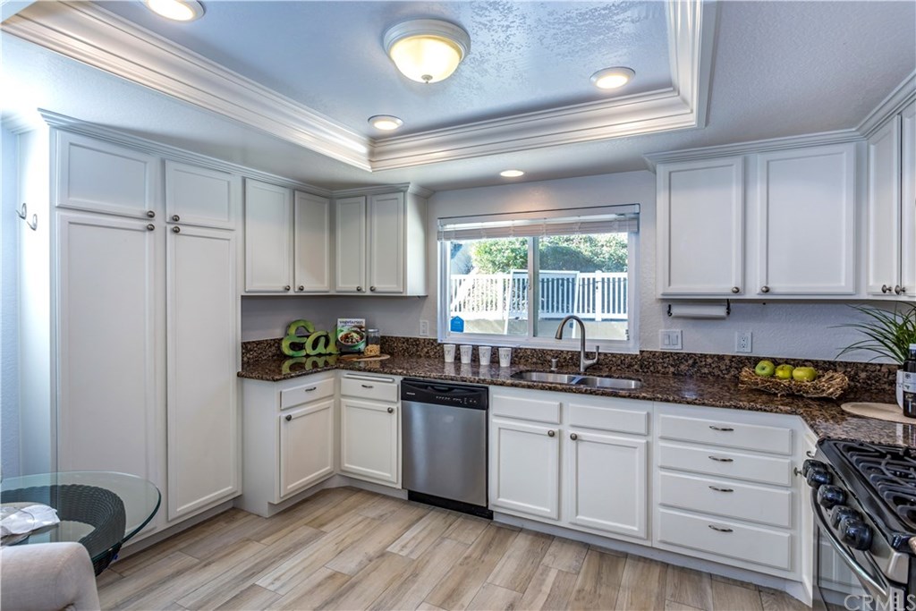 11 Silveroak Aliso Viejo, CA 92656 - Photo 7 of 41 a kitchen with a sink a window and cabinets