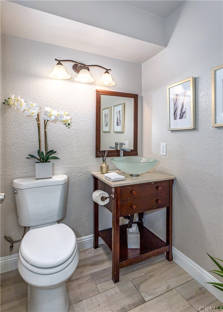 11 Silveroak Aliso Viejo, CA 92656 - Photo 10 of 41 a bathroom with a toilet a sink and mirror