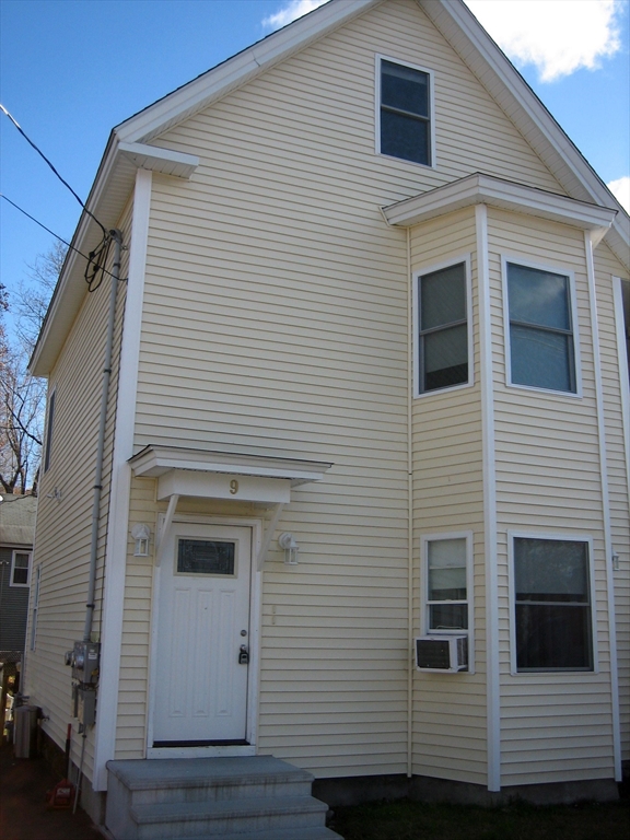 9 Pearl Street, Unit 2 Ayer, MA 01432 - Photo 2 of 10 a view of a house with a yard