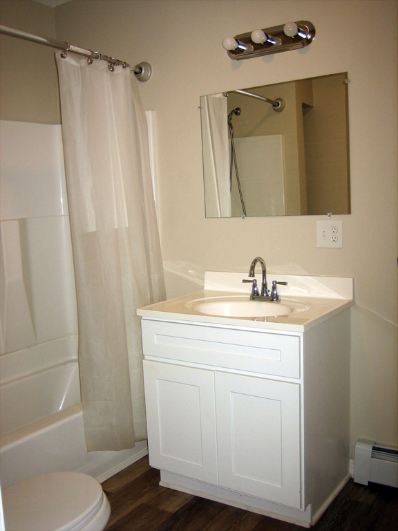9 Pearl Street, Unit 2 Ayer, MA 01432 - Photo 9 of 10 a bathroom with a sink a toilet and shower