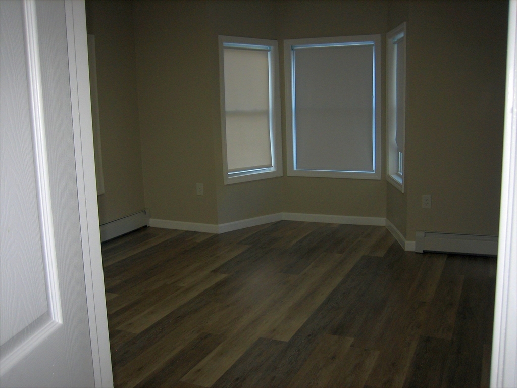 9 Pearl Street, Unit 2 Ayer, MA 01432 - Photo 10 of 10 a view of a small space with wooden floor and a window