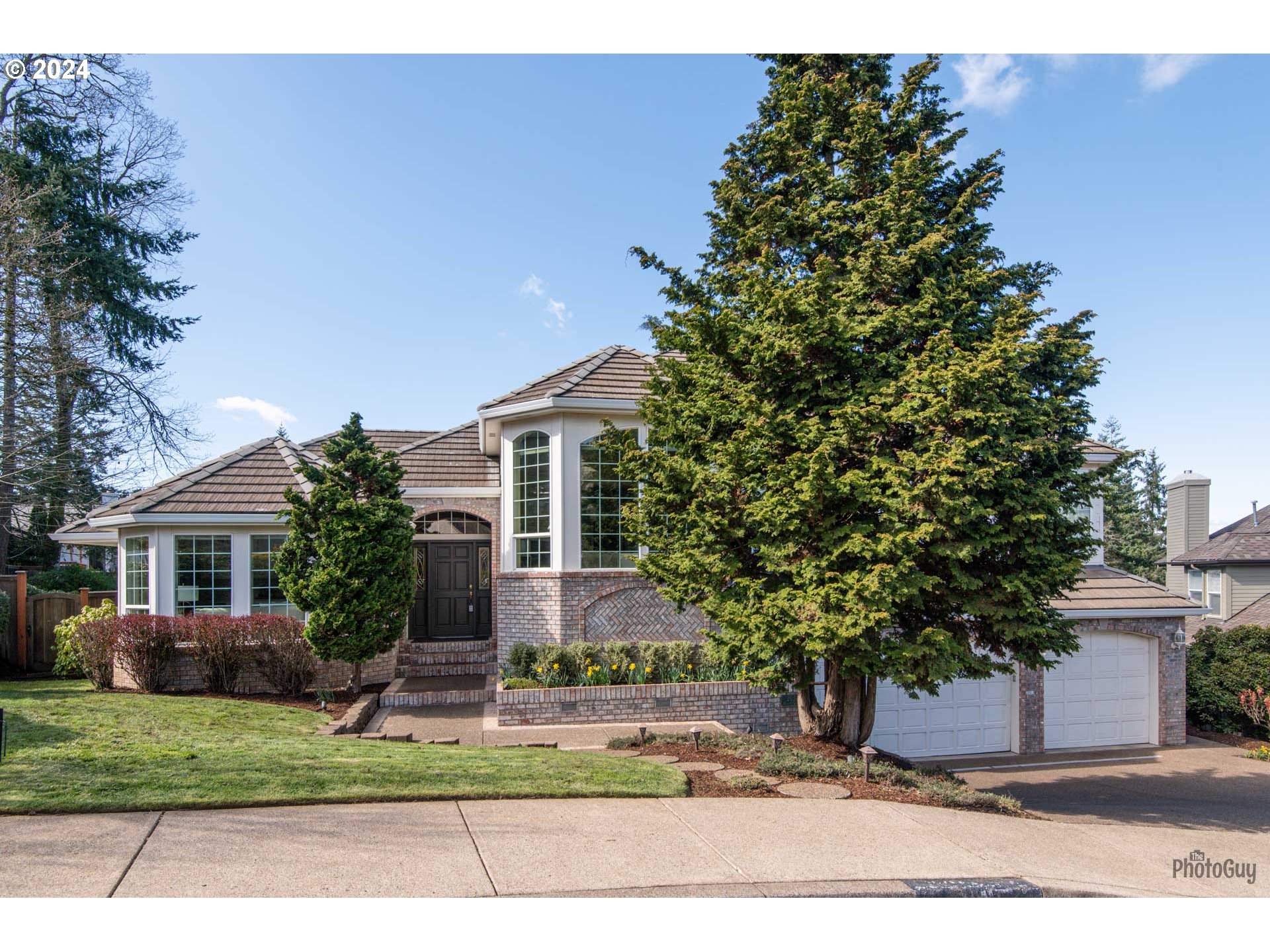 a house with a tree in front of it