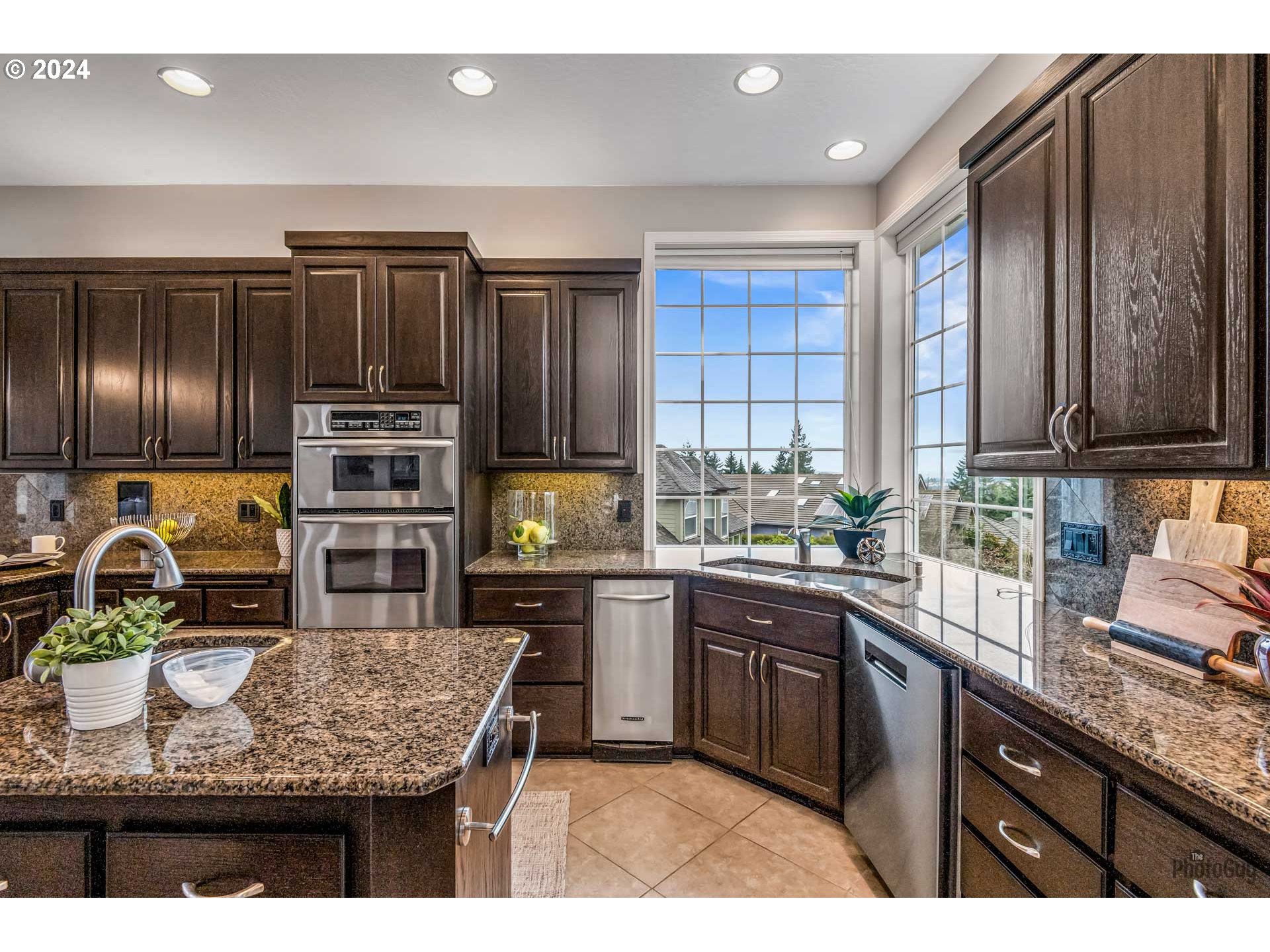 2054 Morning View Drive Eugene, OR 97405 - Photo 14 of 48 a kitchen with kitchen island granite countertop a sink stove and refrigerator