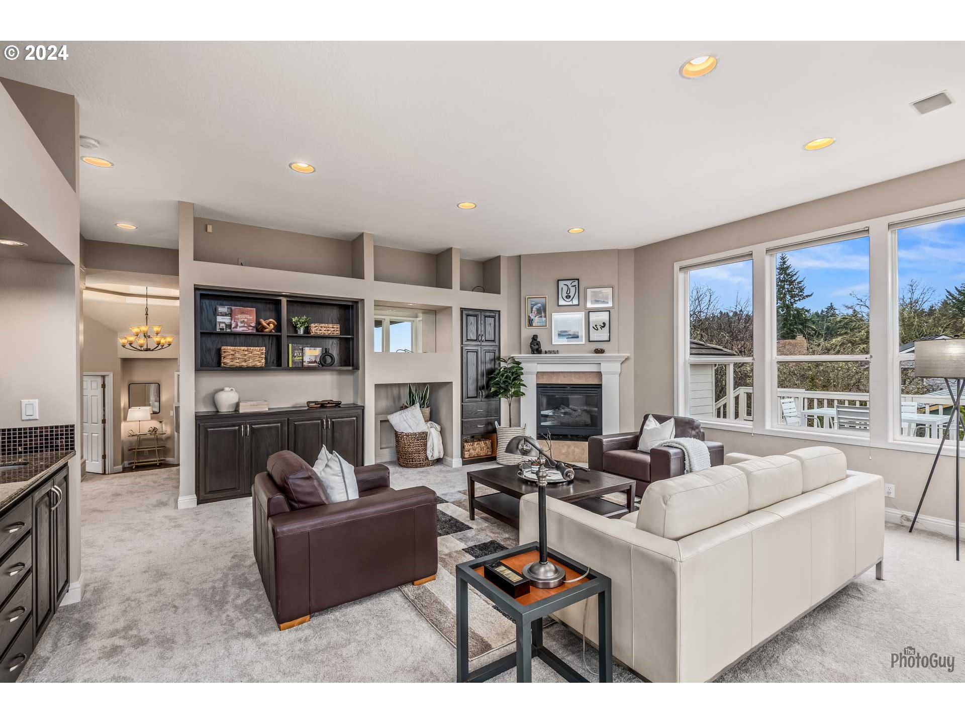 2054 Morning View Drive Eugene, OR 97405 - Photo 23 of 48 a living room with furniture a fireplace and a flat screen tv