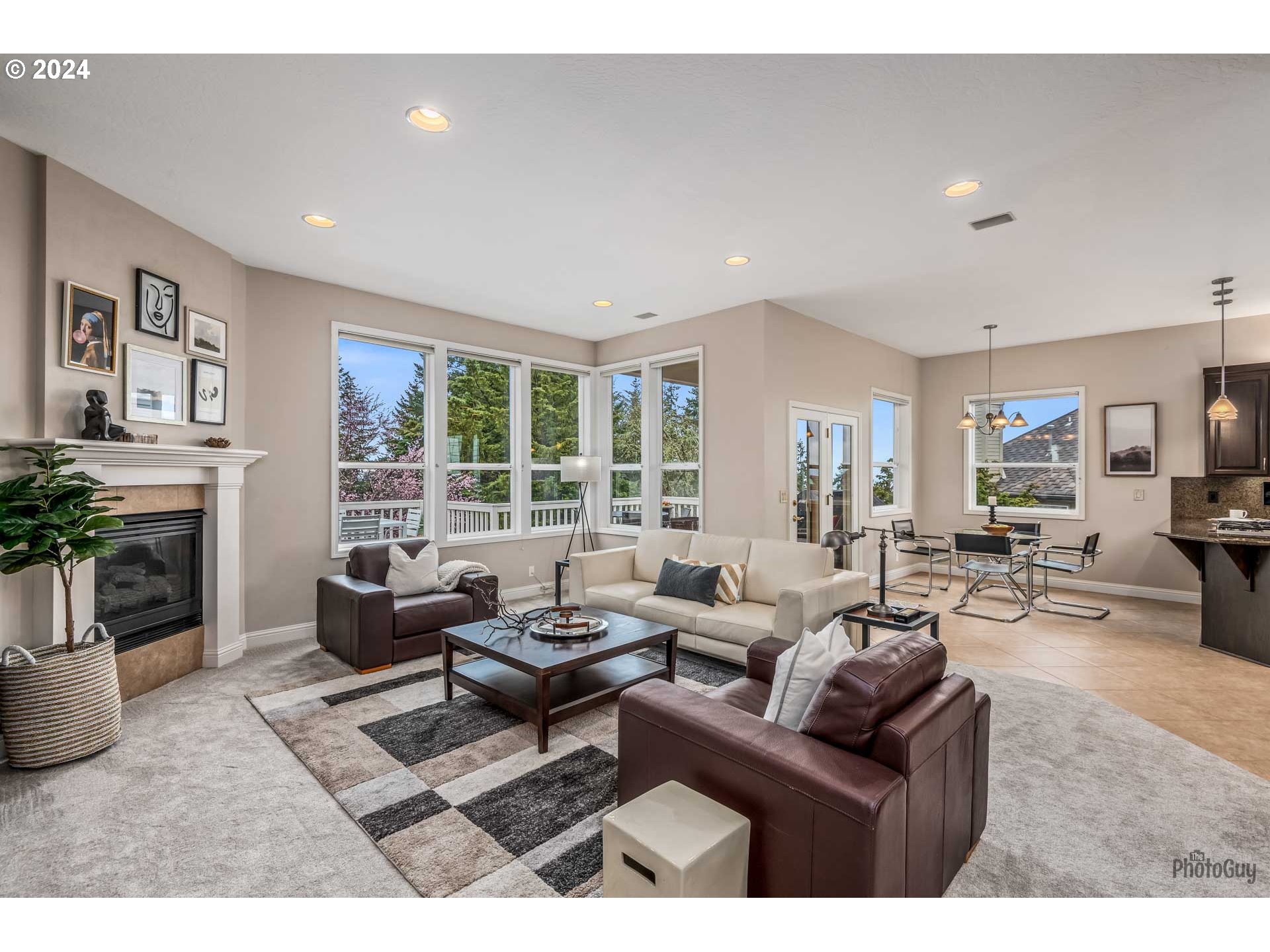 2054 Morning View Drive Eugene, OR 97405 - Photo 25 of 48 a living room with furniture a fireplace and a large window