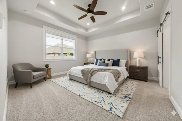 a bedroom with a bed couch and window