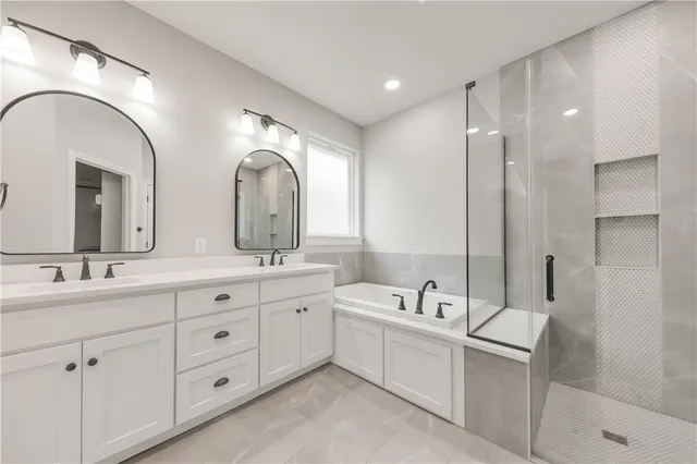 a spacious bathroom with a double vanity sink mirror and double