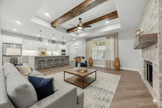a living room with furniture and a fireplace