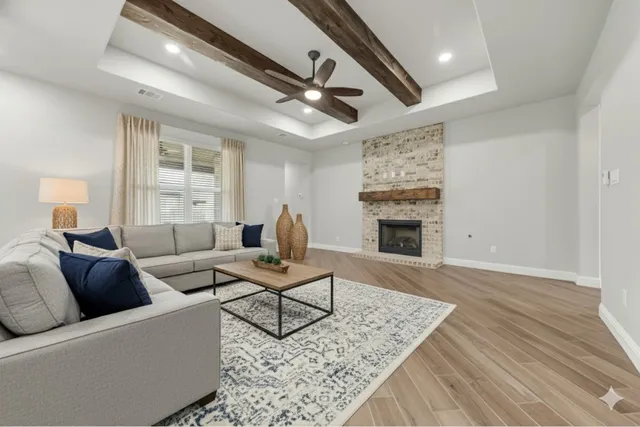 a living room with furniture and a fireplace