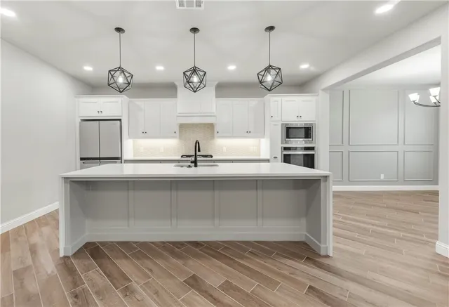 a view of a kitchen with a sink and dishwasher