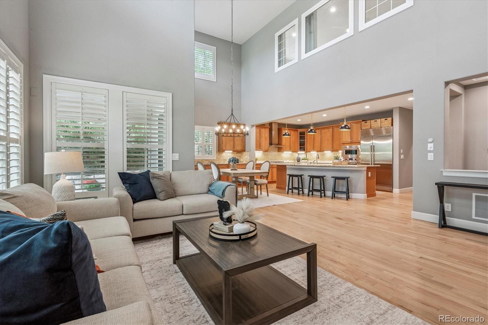 470 Maplehurst Drive Highlands Ranch, CO 80126 - Photo 14 of 46 a living room with furniture dining table and a large window