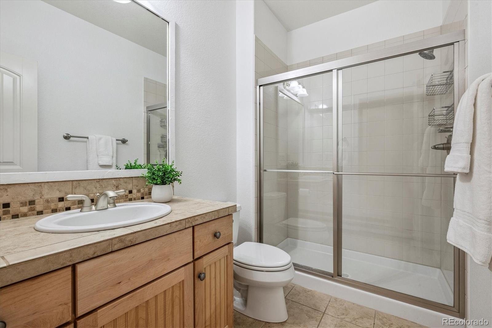 470 Maplehurst Drive Highlands Ranch, CO 80126 - Photo 24 of 46 a bathroom with a sink toilet and shower