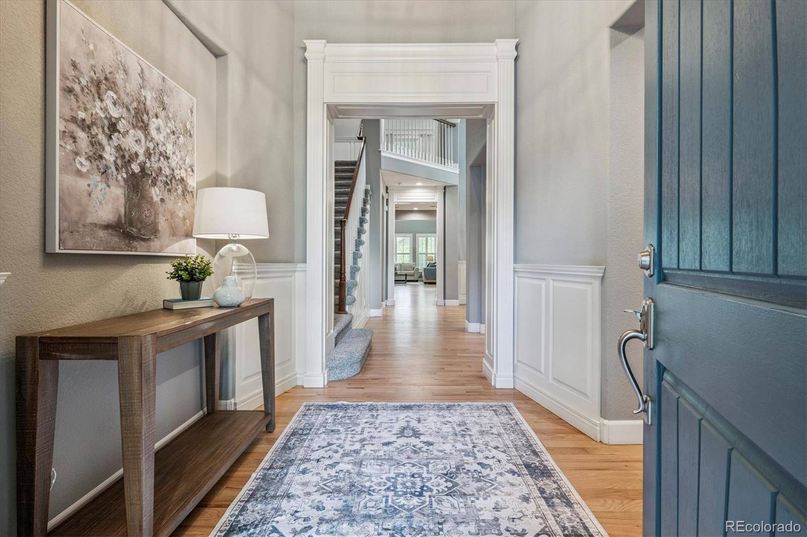 470 Maplehurst Drive Highlands Ranch, CO 80126 - Photo 3 of 46 a view of a hallway to a livingroom and a kitchen
