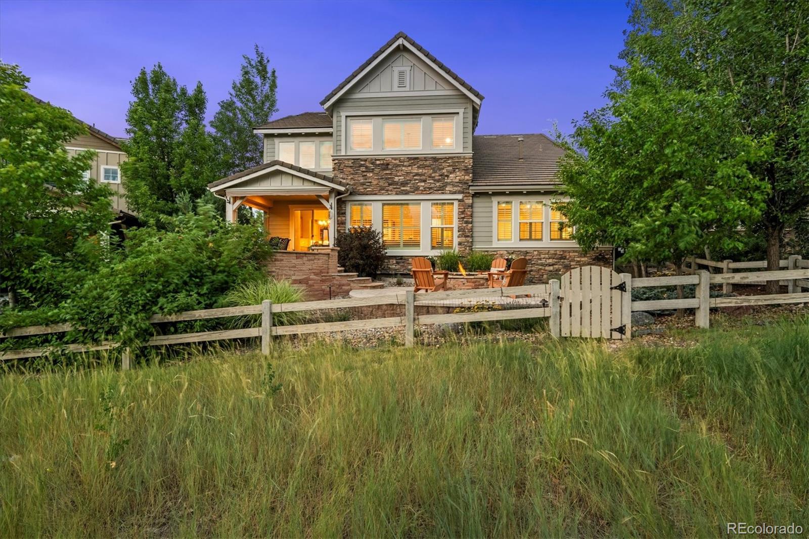 470 Maplehurst Drive Highlands Ranch, CO 80126 - Photo 40 of 46 a front view of a house with a yard