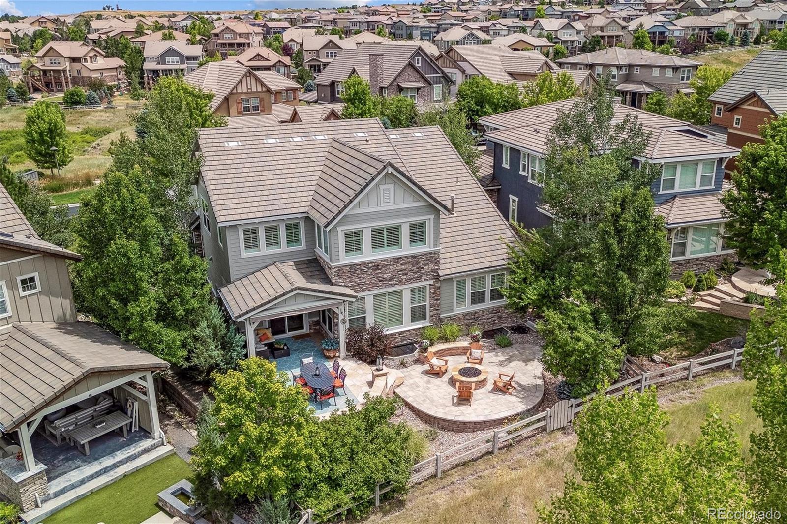 470 Maplehurst Drive Highlands Ranch, CO 80126 - Photo 46 of 46 an aerial view of a house with garden space and a car park in front of house