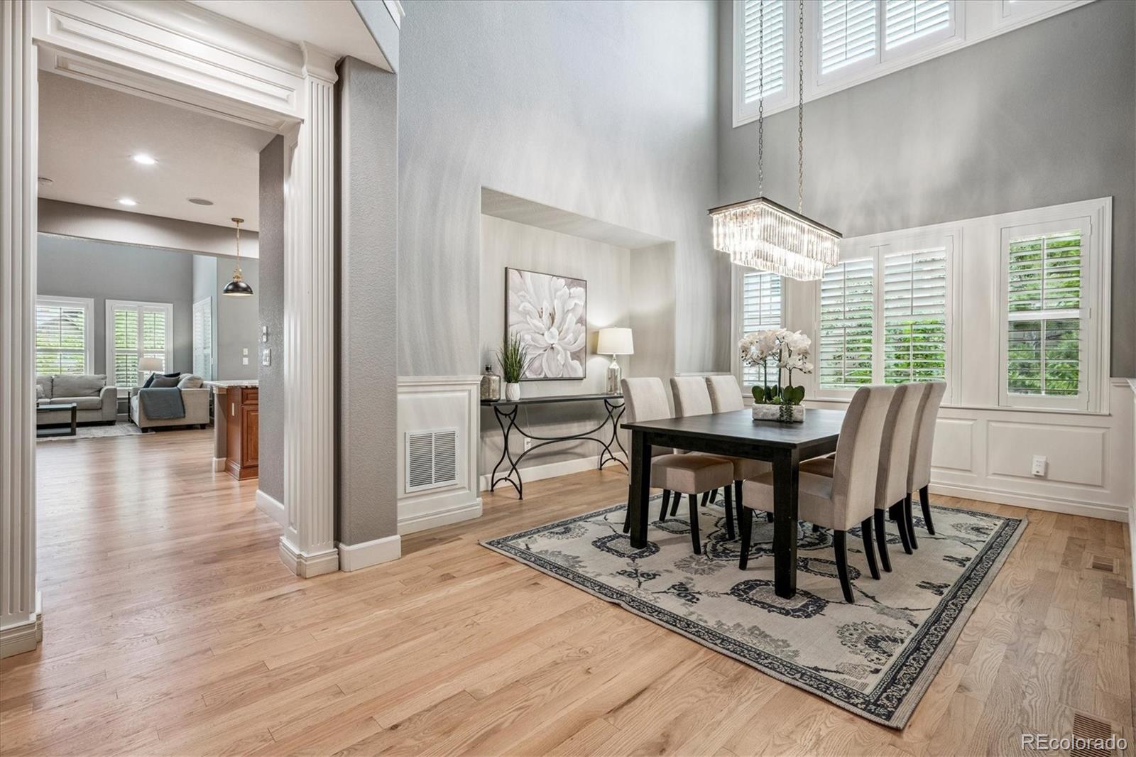 470 Maplehurst Drive Highlands Ranch, CO 80126 - Photo 5 of 46 a view of a dining room with furniture window and wooden floor