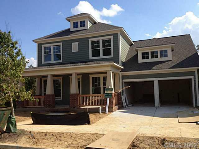 331 Olmstead Street, Unit 1347 Fort Mill, SC 29708 - Photo 1 of 1 a front view of a house with a yard