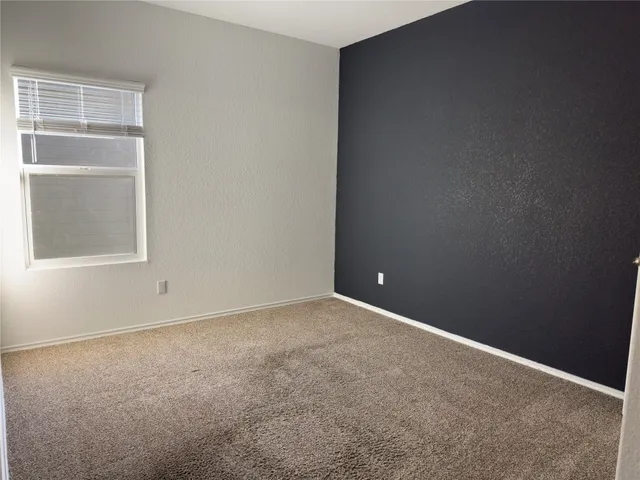 a bathroom with a toilet and a bathtub
