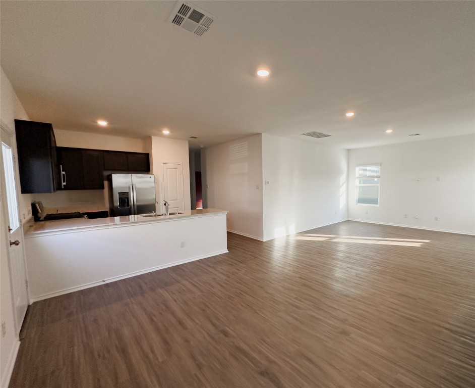 312 Soapstone Pass Maxwell, TX 78656 - Photo 21 of 21 a view of kitchen with cabinets stainless steel appliances wooden floor and windows