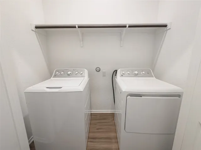 a kitchen with stainless steel appliances granite countertop a refrigerator and a stove