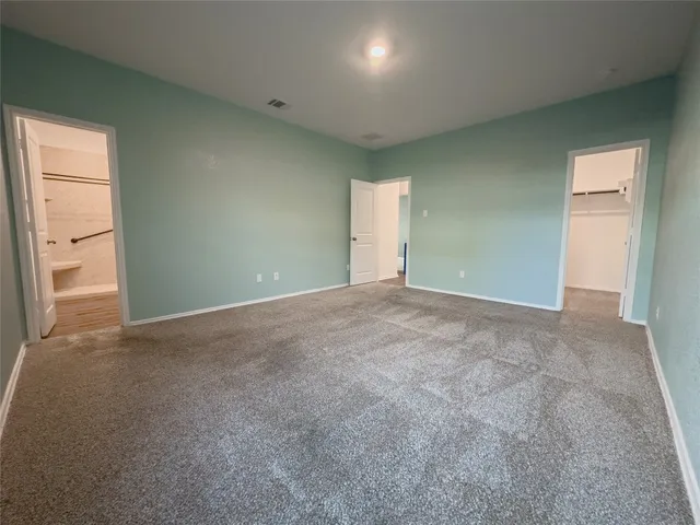 a view of kitchen with cabinets stainless steel appliances wooden floor and windows