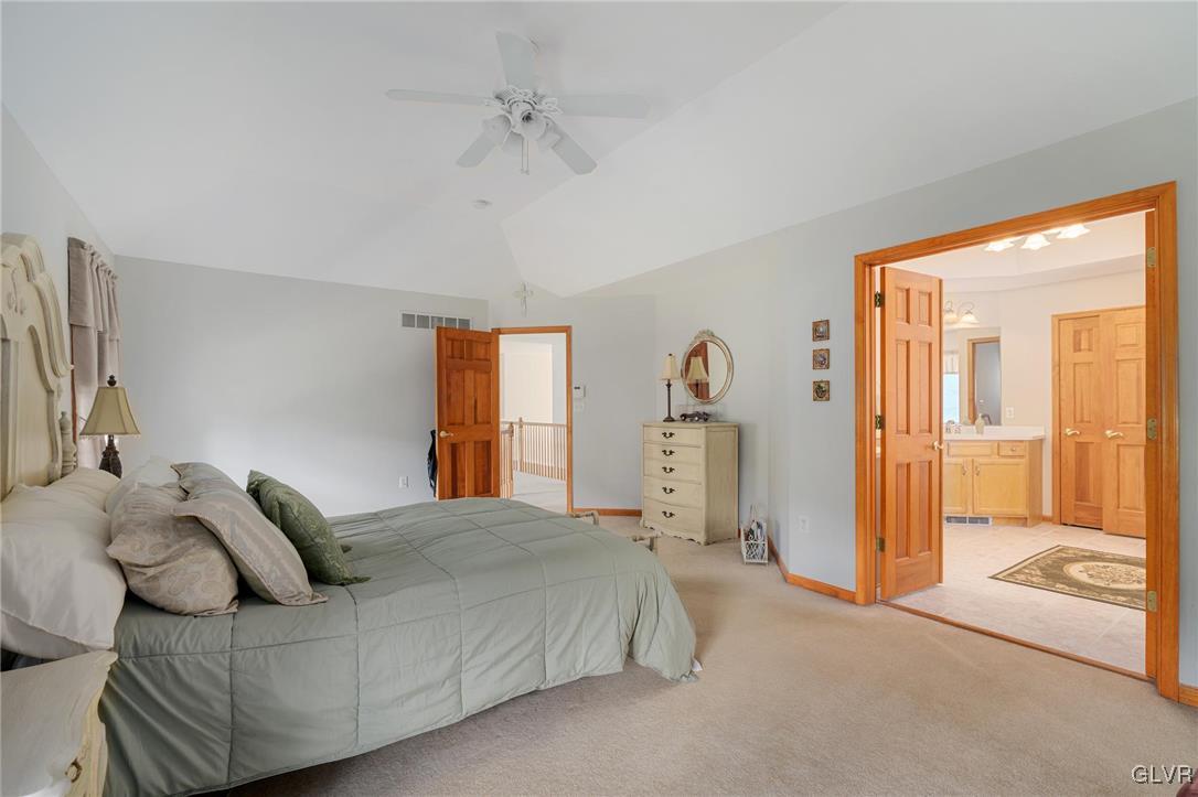 220 West Butternut Road Hellertown, PA 18055 - Photo 38 of 50 a spacious bedroom with a bed and a chandelier