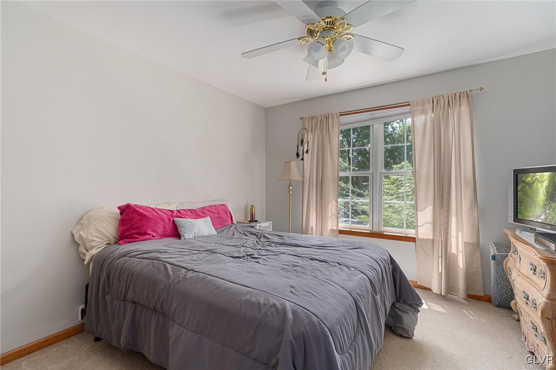 220 West Butternut Road Hellertown, PA 18055 - Photo 42 of 50 a bedroom with a bed and a chandelier