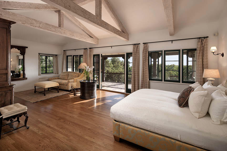 930 Lilac Drive Montecito, CA 93108 - Photo 7 of 25 a bedroom with a large bed and a large window