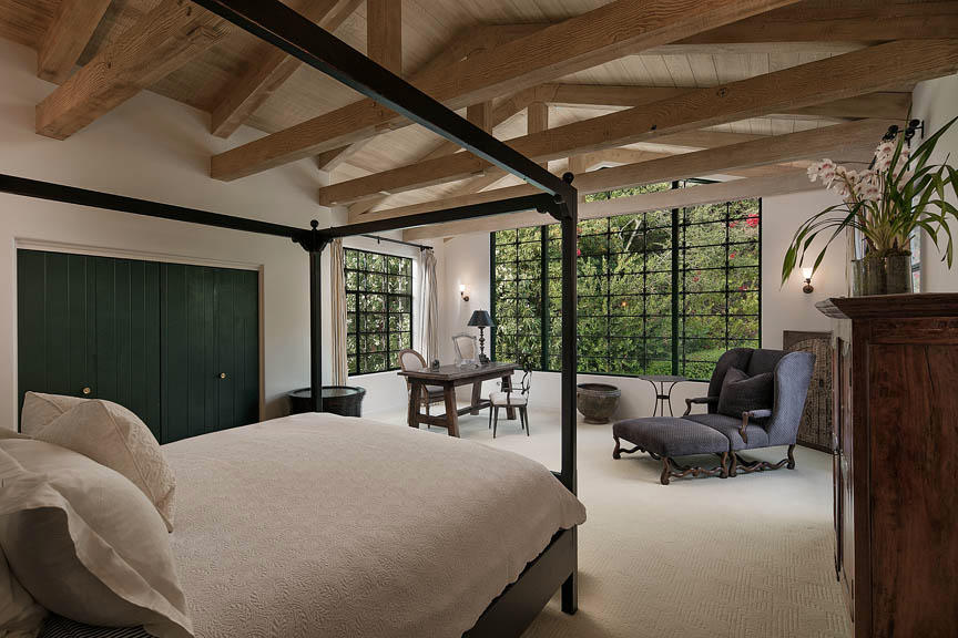 930 Lilac Drive Montecito, CA 93108 - Photo 10 of 25 a bedroom with a bed couch and a large window